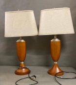 A pair if wooden base table lamps