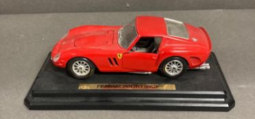 A boxed wine companion and two model cars, a Ferrari 250 GTO on plinth and a Corgi Mercedes 300SL