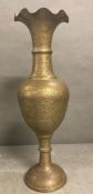 A large brass Indian style vase with crimped rim