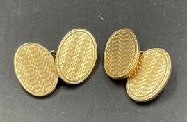 A Pair of machine tooled 9ct yellow gold cuff links (Approximate Total Weight 12.3g)