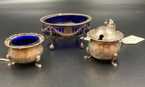 Three silver cruets with blue glass liners, various styles, makers and hallmarks
