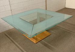 A frosted glass topped coffee table on a wrought iron V shaped base (H42cm W100cm D100cm)