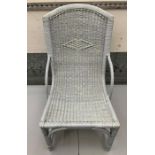 A wicker easy chair and matching table