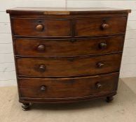A bow fronted mahogany chest of drawers (H107cm W106cm D52cm)