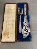 A pair of silver handled fish servers cased, makers mark JN