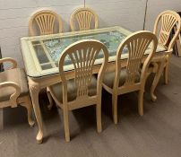 An interesting embellished dining table with six chairs