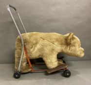 A Vintage push along and ride on Bear