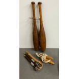 A pair of wooden vintage juggling batons and skipping ropes