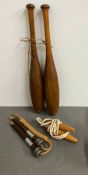 A pair of wooden vintage juggling batons and skipping ropes