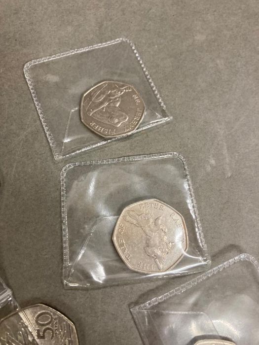 A quantity of British commemorative fifty pence and two pound coins, Peter Rabbit, VC, D Day, Bill - Image 3 of 4