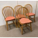A set of four light oak Windsor chairs