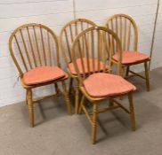 A set of four light oak Windsor chairs