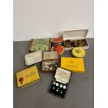 A selection of vintage tins, buttons and collar studs