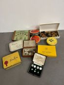 A selection of vintage tins, buttons and collar studs