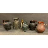 A selection of vintage clay pots and amphora and a stoneware bottle