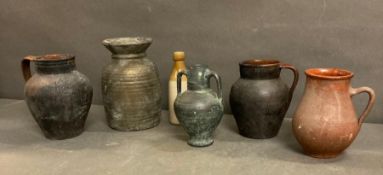 A selection of vintage clay pots and amphora and a stoneware bottle