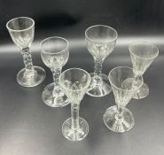 Six wine glasses with cup bowls and facet stems (Five have chips to base)