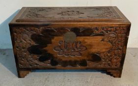 An antique hand carved oriental camphor chest (H60cm W104cm D52cm)
