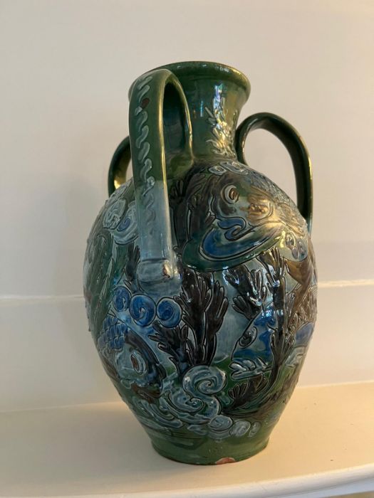 A CH Brannam art pottery three handled vase. An earthenware vase decorated in relief design. the - Image 3 of 7