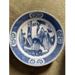 A late century Chinese blue and white porcelain dish, painted with figural scene of two