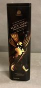 A Bottle of Johnnie Walker Black Label in a gift tin.