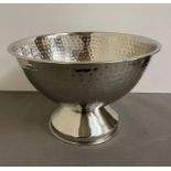 A metal hammered champagne/ice bucket (H27cm Dia40cm)