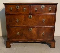 A walnut two over two chest of drawers with brass drop handles AF (H74cm W80cm D42cm)