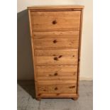A five drawer tall pine chest of drawers (H121cm W58cm D45cm)