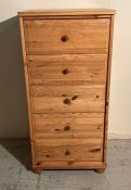 A five drawer tall pine chest of drawers (H121cm W58cm D45cm)
