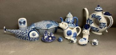 A selection of blue and white ceramics to include a miniature tea service and various jugs and tea