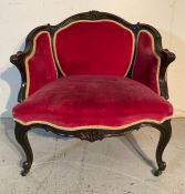 A Louis XV style armchair on cabriole legs with castors