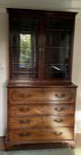 A mahogany Secretaire bookcase. Elegant bookcase sat upon four drawers, top drawer opening to a