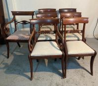 Six Georgian style mahogany dining chairs and a carver with scrolling arms
