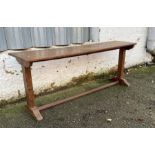 An oak console table on splayed feet (H75cm W198cm D45cm)