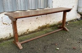 An oak console table on splayed feet (H75cm W198cm D45cm)