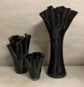 A selection of three Art glass black handkerchief vases