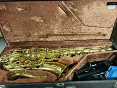 A Yamaha 32 Tenor saxophone in case with stand