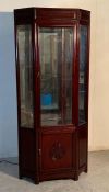 A rosewood oriental style display cabinet with light fitting and three glass shelves (H183cm D43cm)