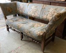 An alboston floral pattern upholstered French sofa on castors
