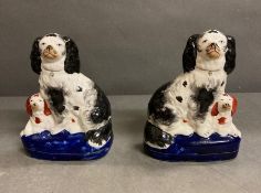 A pair of Staffordshire King Charles spaniels