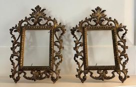A pair of easel backed gilt picture frames