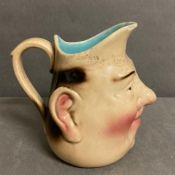 A Sarreguemines stoneware jug with face