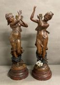 A pair of French Art Deco bronze table lamps in the manor of Auguste Moreau