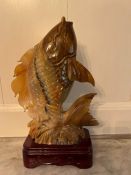 A carved oriental carp on stand (H37cm)
