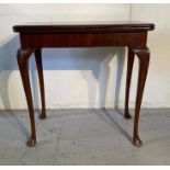 An antique mahogany card table on cabriole legs (H75cm W77cm D46cm)