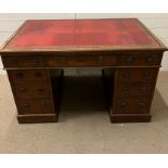 A pedestal desk with red leather inset (76cm x 122cm x 75cm)