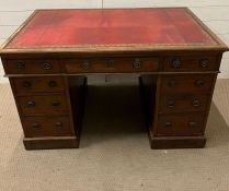 A pedestal desk with red leather inset (76cm x 122cm x 75cm)