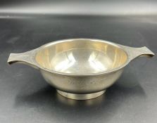 A silver porringer, hallmarked for Edinburgh 1934 by Mackay & Chisholm, engraved. Approximate