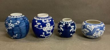 Four white and blue Chinese ginger jars