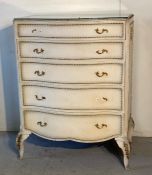 A white painted Louis style dressing table with a five drawer matching set of drawers